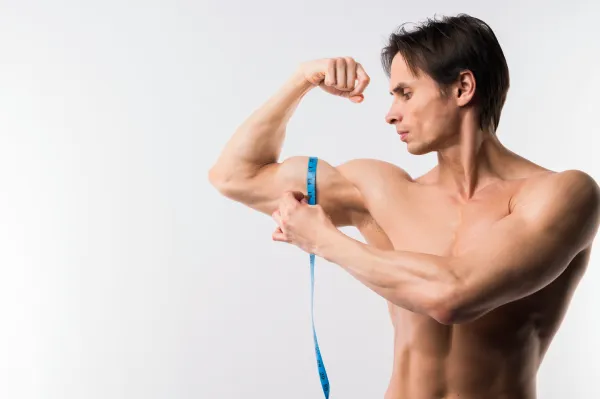 front-view-athletic-man-measuring-biceps front view athletic man measuring biceps