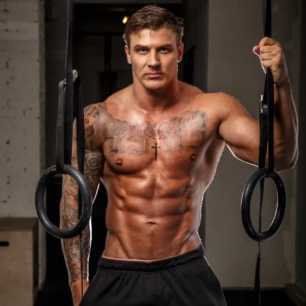 muscled-adult-athlete-studio-wearing-black-pants muscled adult athlete studio wearing black pants