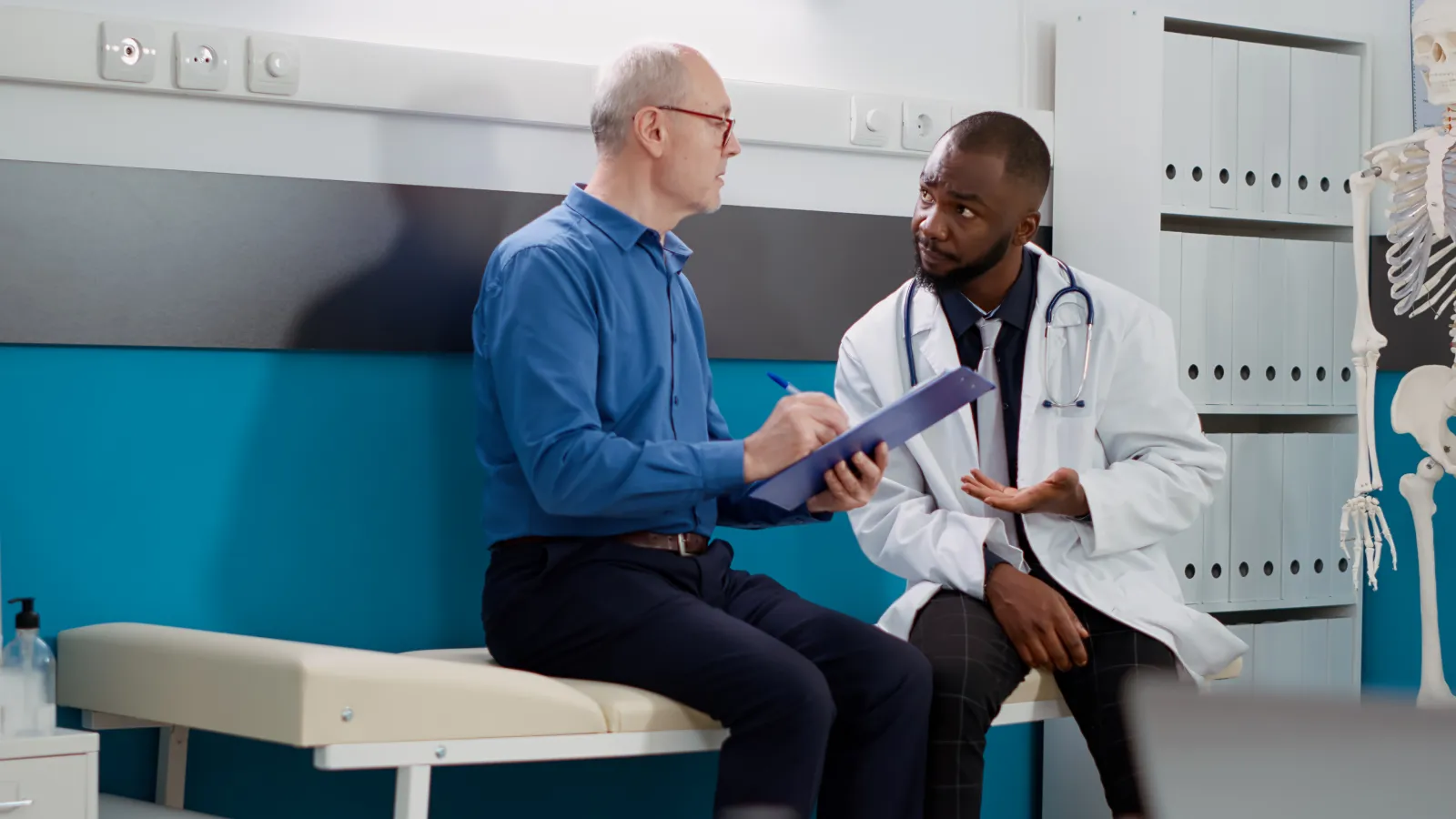 Elderly-man-signing-consultation