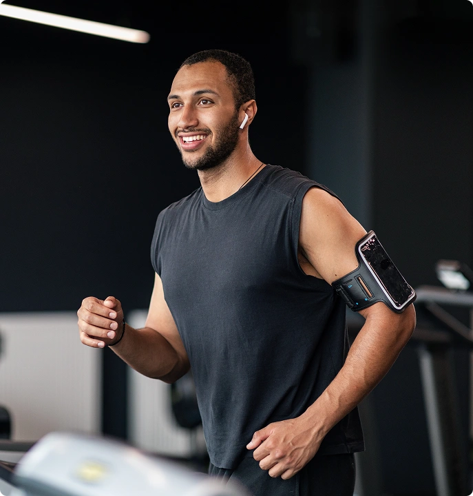 Man running on treadmill for fitness