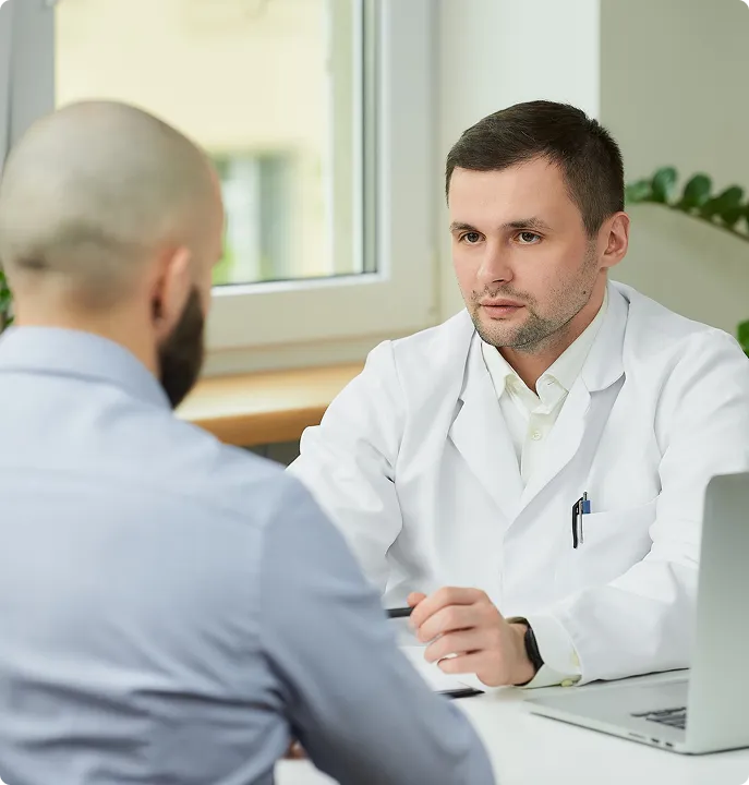 Doctor discussing trt pricing options with patient