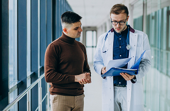 Doctor explaining trt treatment plan to patient in clinic