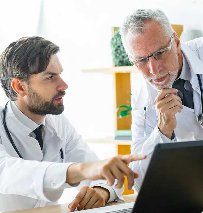 Medical specialists reviewing trt treatment cost plans