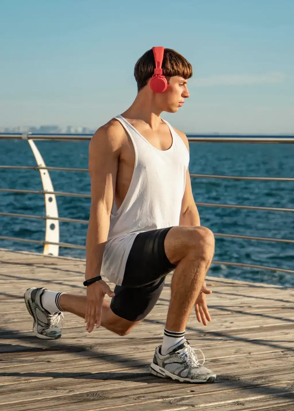 man-listening-music-beach-headphones-while-working-out (2)